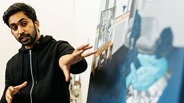 Student explaining a piece of artwork