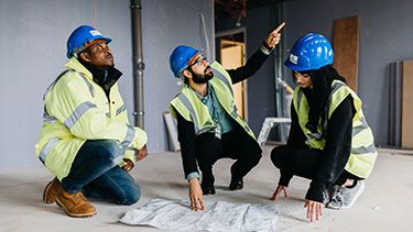 Students wearing high-vis vests and hard hats