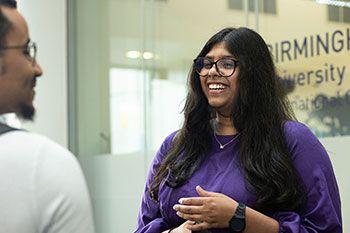 Female student chatting to friend at BCUIC college