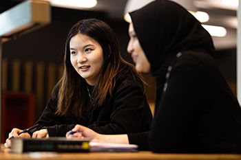 Two female students studying together