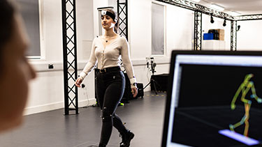 Student using motion capture software while walking