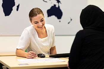 Staff helping student at BCUIC college