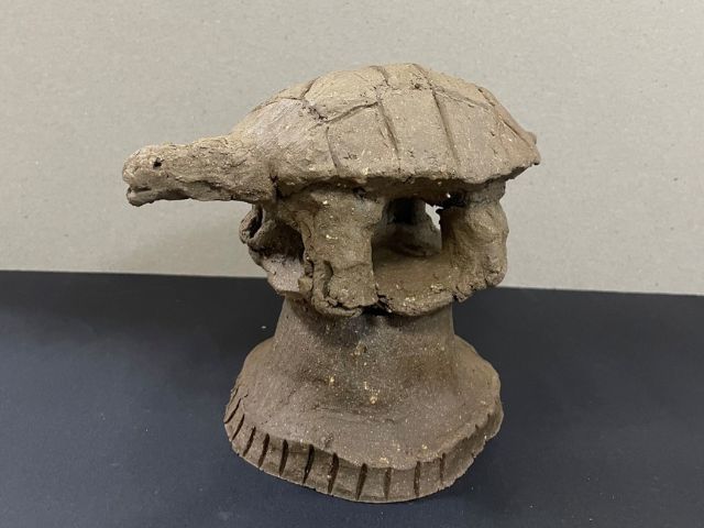 Clay model of turtle on a pedestal