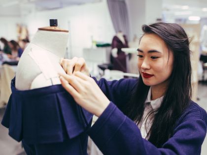 Female student working on a fashion design