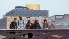 Students standing on bridge in Birmingham