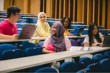 Students sitting together in a lecture theatre