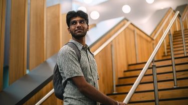 Student standing on the stairs